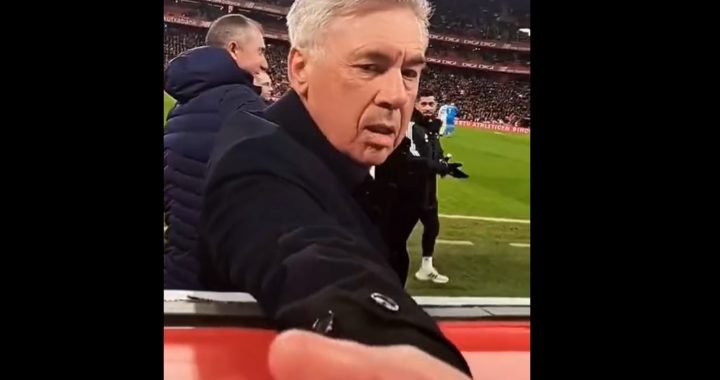 Real Madrid manager Carlo Ancelotti hands out gum to fans in stands